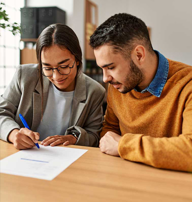 Couple signing a mortgage
