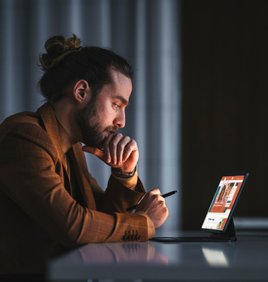 Man reviewing bank website on smart tablet.