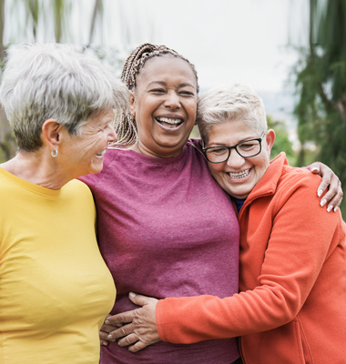 Group of three senior women having fun at the park