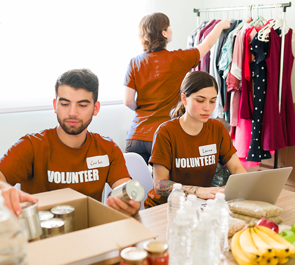 Company volunteers sorting items