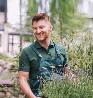 Landscaper working in garden.
