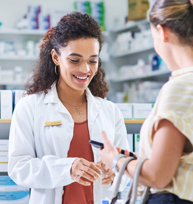 Customer paying a pharmacist with her HSA debit card.
