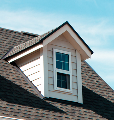 Detail of roof and dormer of suburban home.