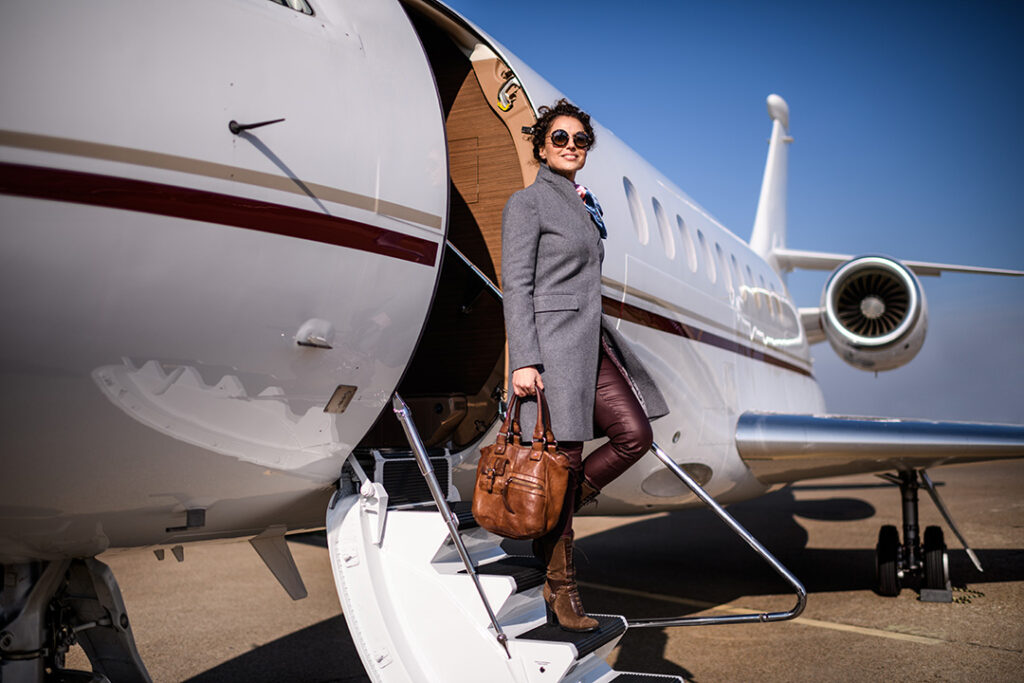 Woman leaving private plane