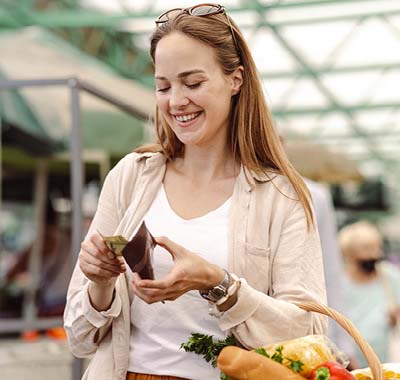 A young woman shopping for groceries