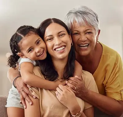 A smiling family of three generations of womens