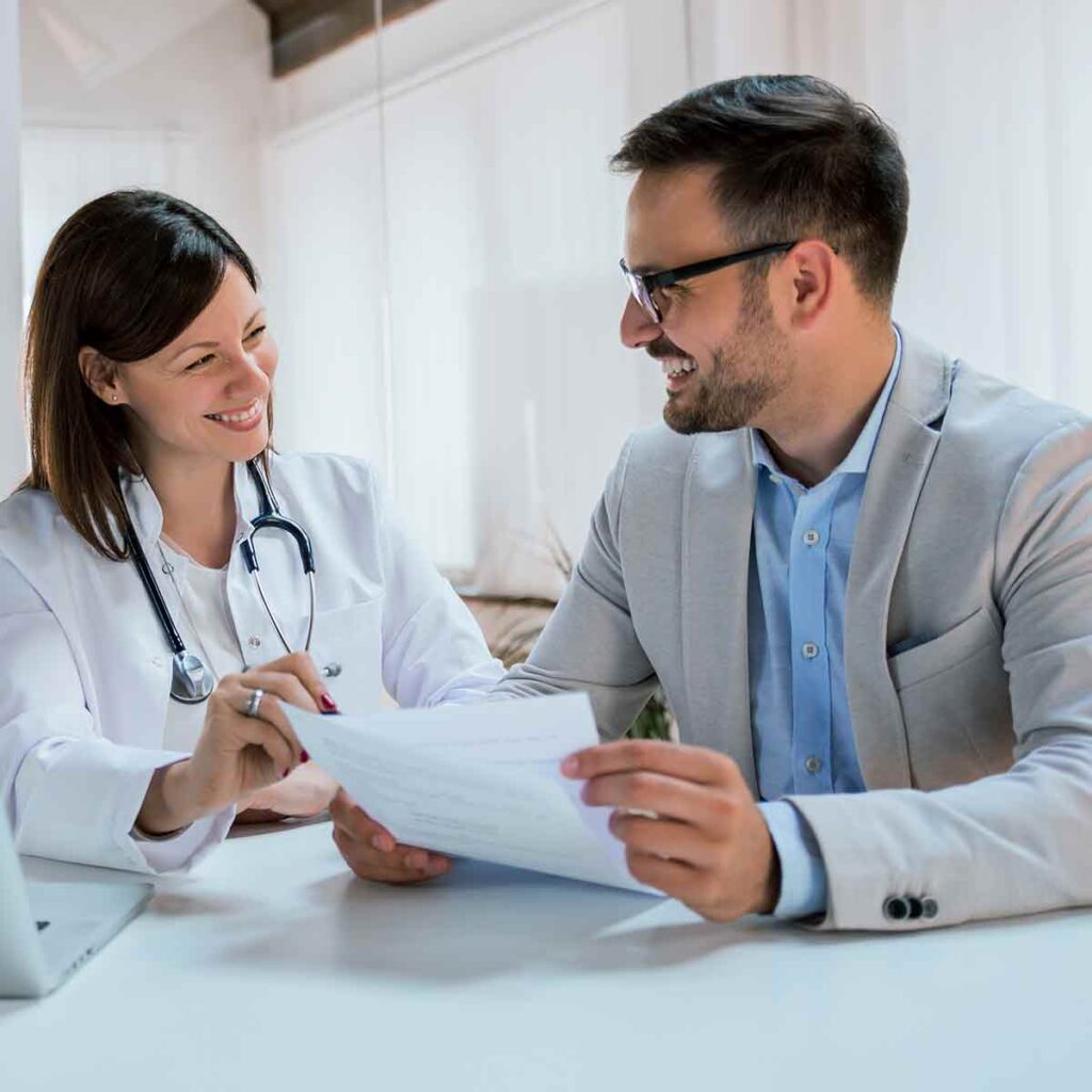 Doctor reviewing medical practice loan options with their private banker
