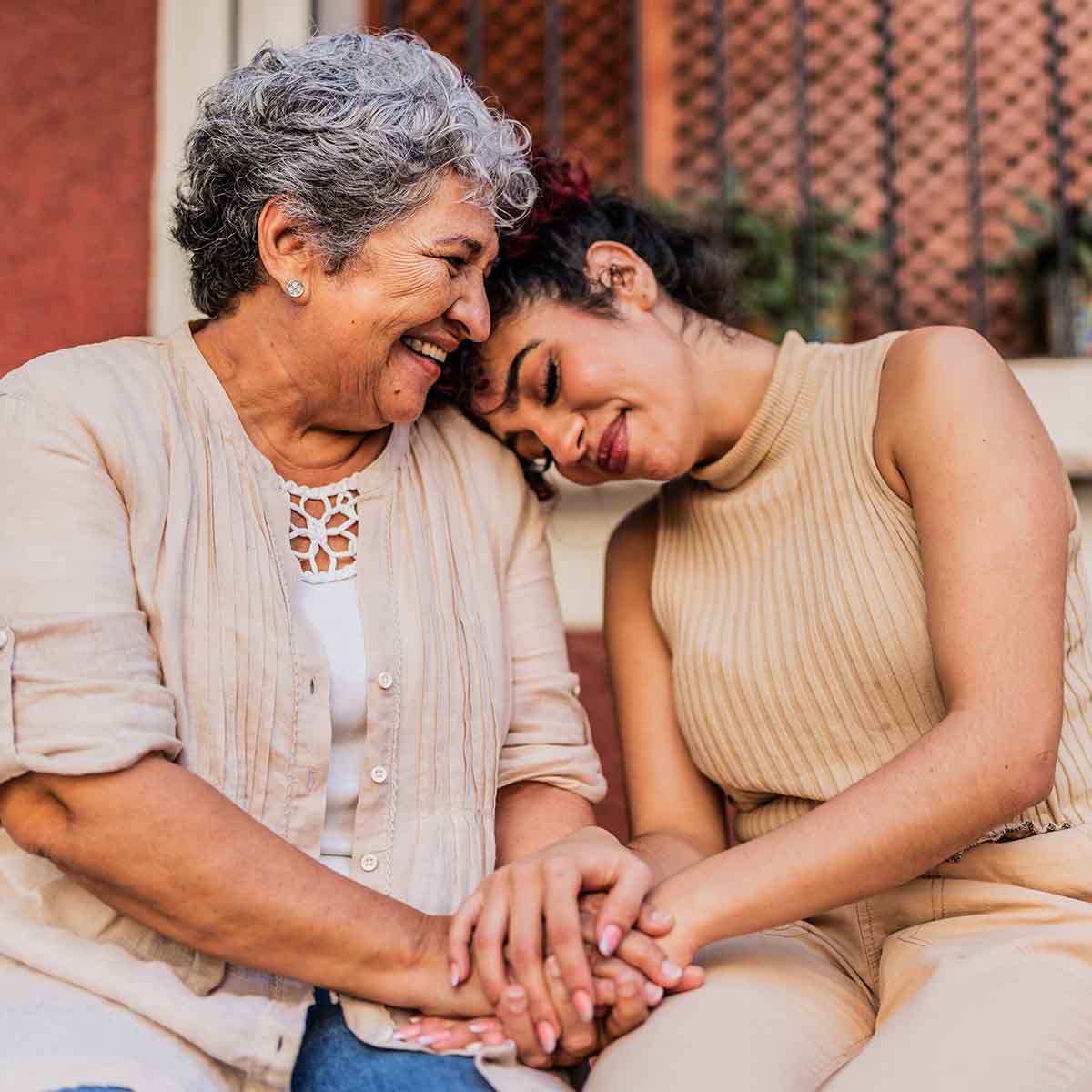 Grandmother and granddaughter hugging, symbolizing the importance of financial security