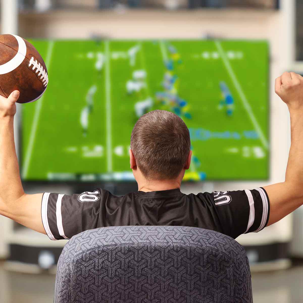 Fan watching football on TV