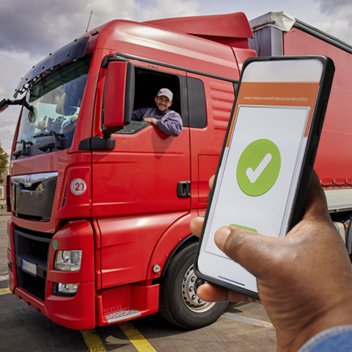 A person using a smartphone to process immediate electronic payment for an LTL semi delivery