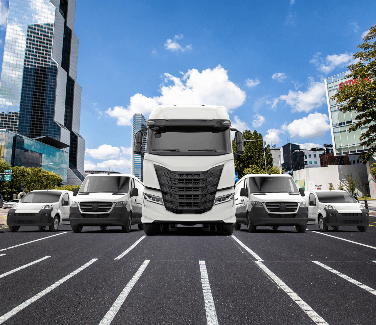 Image of two SUVs, Delivery Vans, and a long haul truck driving down an urban road