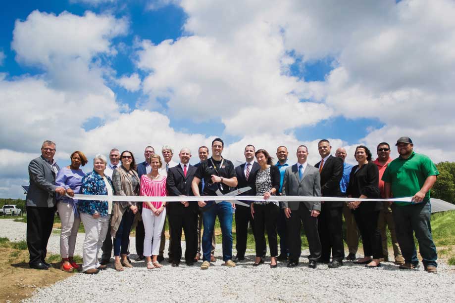 The ribbon cutting ceremony for a commercial solar financing project funded by 1st Source Bank