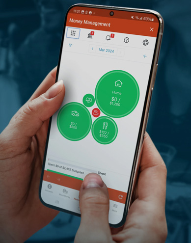 A closeup of a person using the 1st Source Bank Money Management app on their smart phone.
