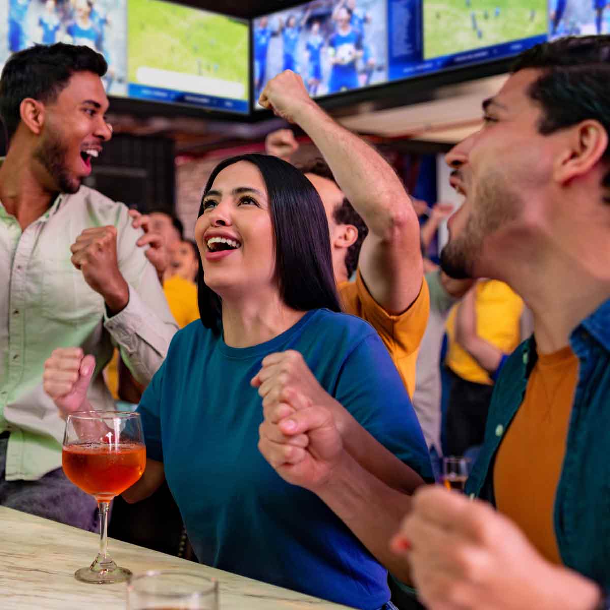 Soccer fans watch the World Cup at a local sports bar