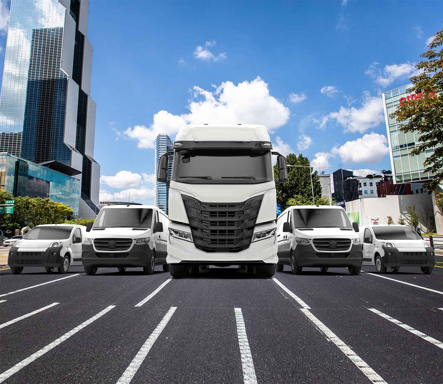 Commercial fleet vehicles including SUVs, delivery vans, and a long-haul truck traveling on a highway, illustrating 1st Source Bank fleet financing plans and solutions.