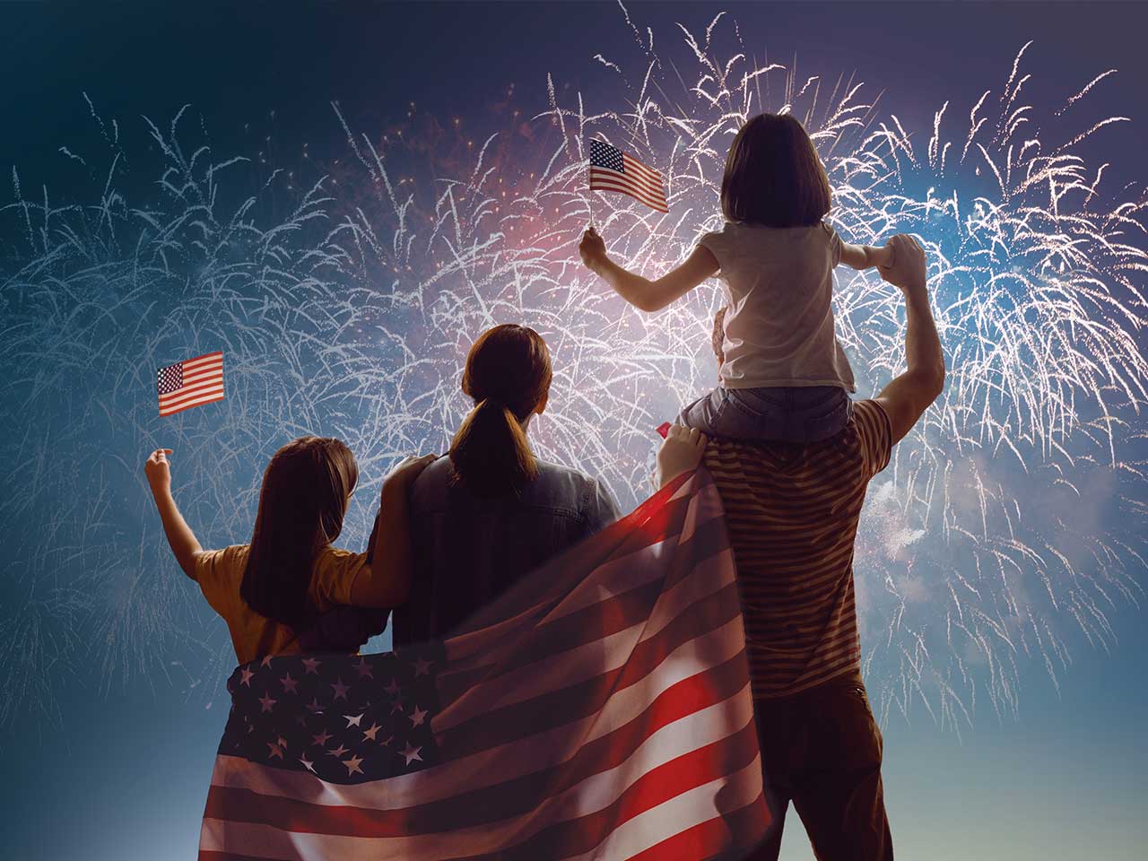 A family watching fireworks and celebrating the 4th of July