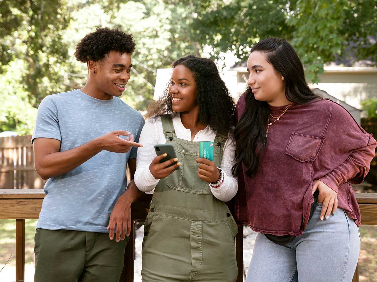 A group of preteens spending time together, using the 1st Source Bank Greenlight debit card to pay for their purchases