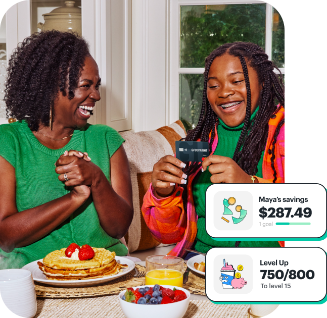 A child uses the Greenlight app for savings goals and financial education games