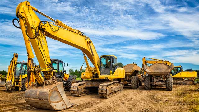 Excavator, dozer, and articulated dump truck working at a construction site